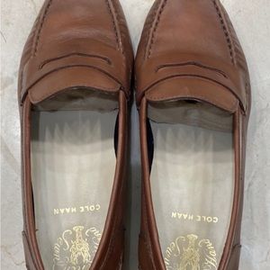 Cole Haan leather penny loafers.